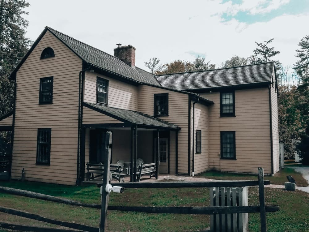 A two-story home with fresh siding and a new roof